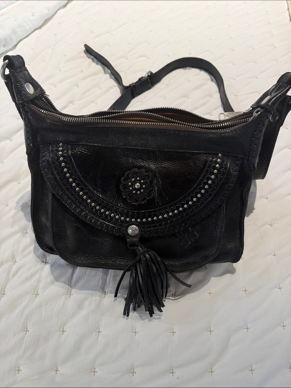 Patricia Nash Black Leather Shoulder Bag with Tassel & Stud Accents